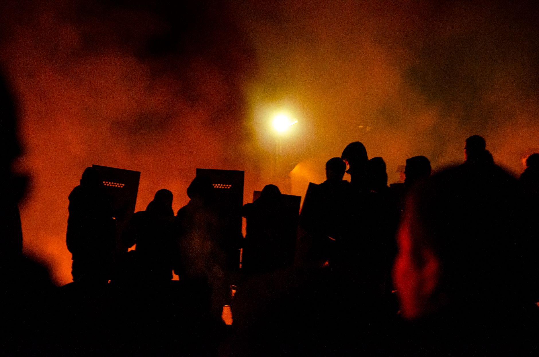 policemen with shields at night