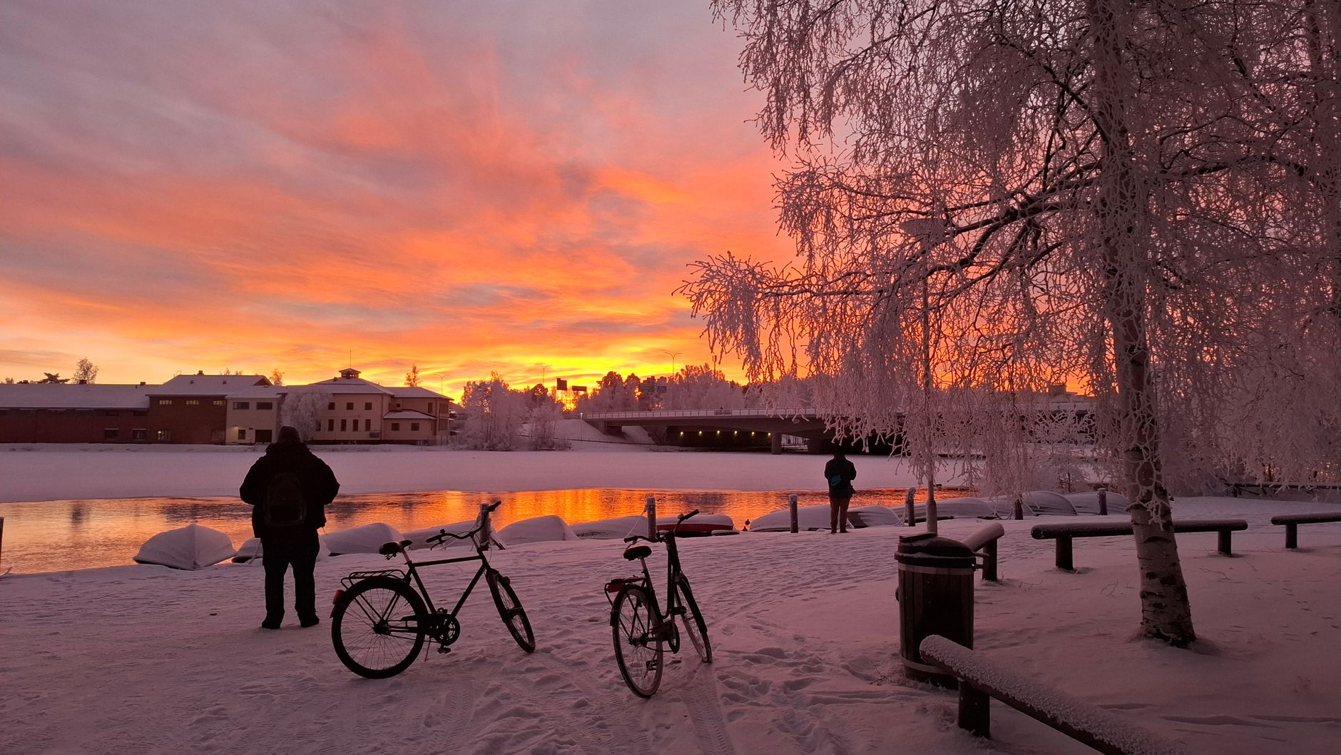 winter sunset over frozen river in oulu finland